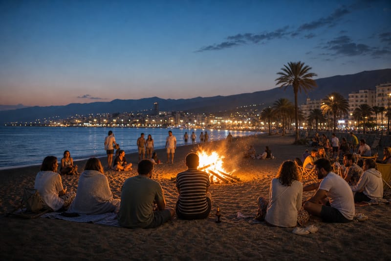 Bonfires and groups of people on the beach during the Noche de San Juan
